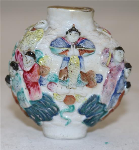 A Chinese famille rose moulded porcelain snuff bottle, Qianlong mark, c.1821-50, height 6.2cm